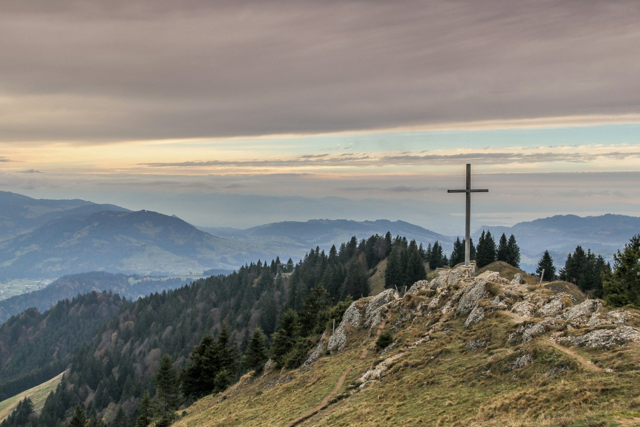 An image of a cross on a mountain