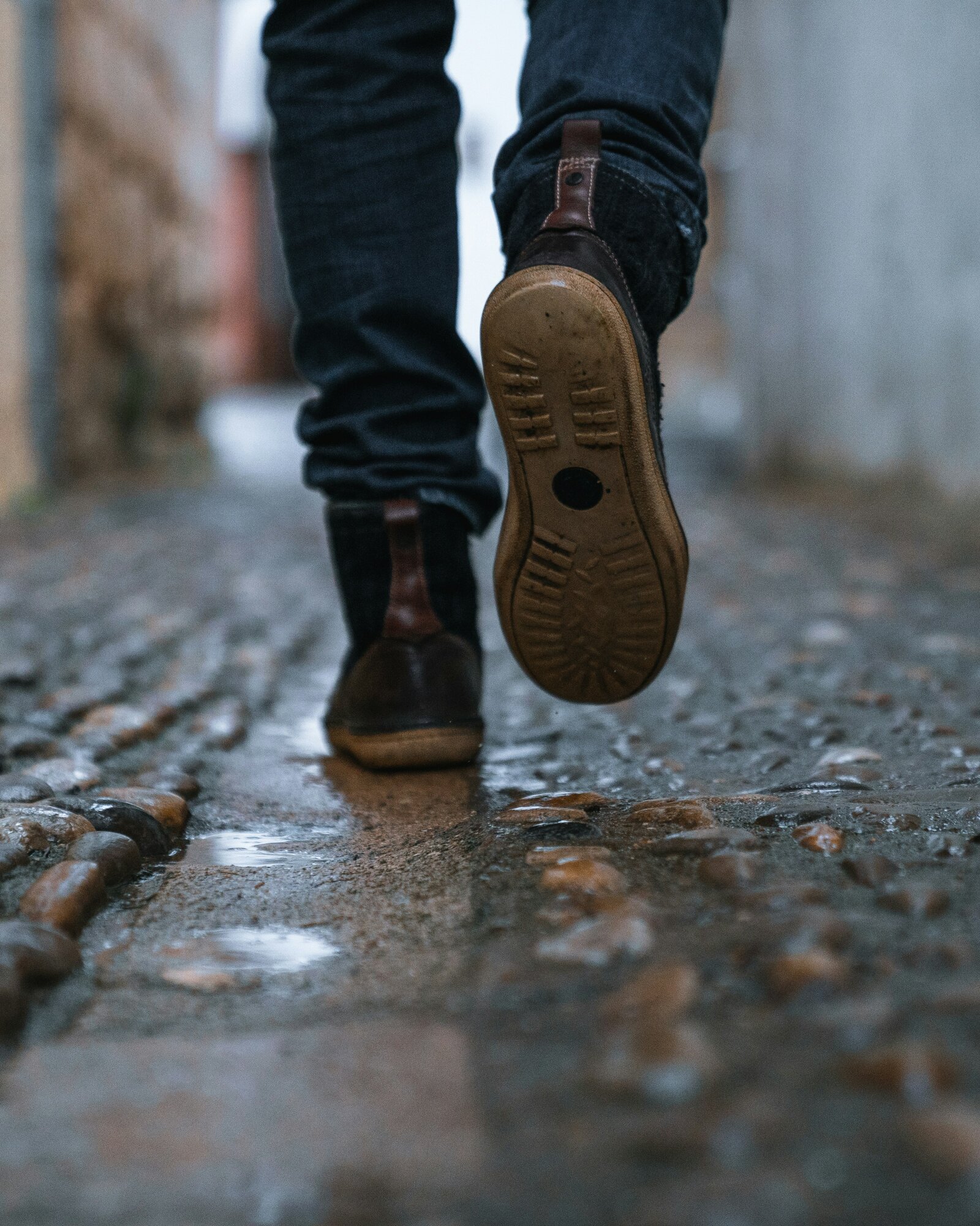 An image of a persons feet as they are walking