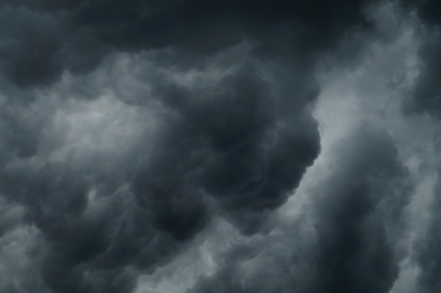 An image of a dark, grey stormy sky